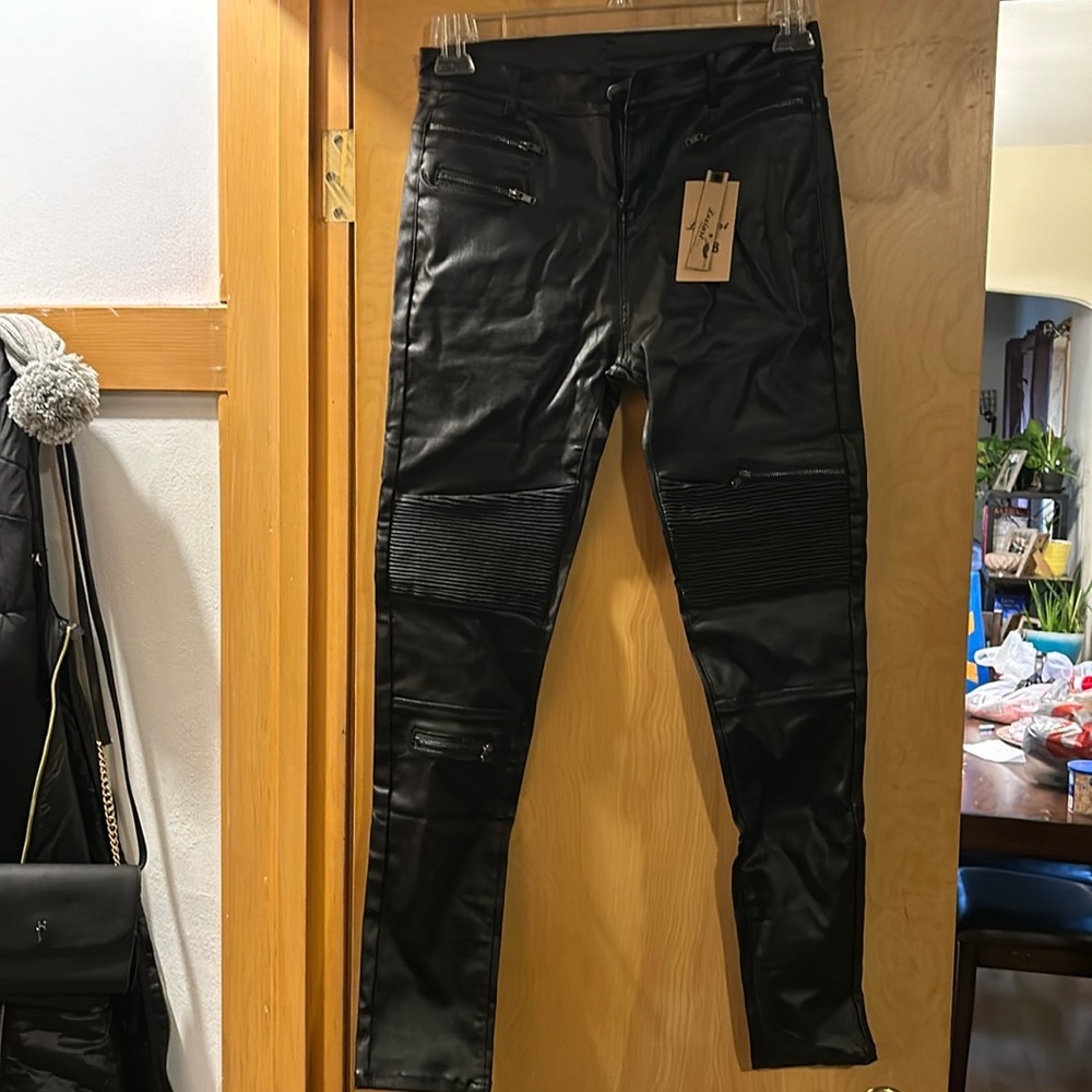 Fake leather. Not real. Never worn.